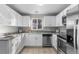 Modern kitchen with stainless steel appliances and granite countertops at 6963 S Albion St, Centennial, CO 80122