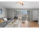 Living room with hardwood floors, large windows, and seating at 6963 S Albion St, Centennial, CO 80122