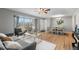 Bright and airy living room with hardwood floors and seating at 6963 S Albion St, Centennial, CO 80122