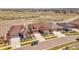 Aerial view of a suburban home showcases a well-maintained lawn and neighborhood at 6450 S Riverwood Ct, Aurora, CO 80016