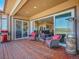 Outdoor deck featuring a grill, chairs, a heater, and scenic views at 6450 S Riverwood Ct, Aurora, CO 80016