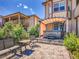 Landscaped backyard with a hot tub, seating area, and lush greenery at 6450 S Riverwood Ct, Aurora, CO 80016