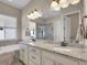 This updated bathroom showcases granite countertops, modern lighting, and a separate tub and shower at 6450 S Riverwood Ct, Aurora, CO 80016