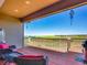Enjoy serene views from this spacious deck with comfortable seating and peaceful, natural surroundings at 6450 S Riverwood Ct, Aurora, CO 80016