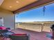 Relaxing outdoor deck with comfortable seating and scenic views of the surrounding landscape at 6450 S Riverwood Ct, Aurora, CO 80016