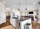 Open concept kitchen with a large island, and a seamless transition into the living area at 6450 S Riverwood Ct, Aurora, CO 80016