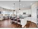 Bright kitchen featuring modern white cabinetry, dark countertops and stainless steel appliances at 6450 S Riverwood Ct, Aurora, CO 80016