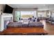 Cozy living room with sliding glass doors opening to a deck and offering amazing views at 6450 S Riverwood Ct, Aurora, CO 80016