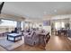 Spacious living room flows into the kitchen and dining area, perfect for entertaining guests at 6450 S Riverwood Ct, Aurora, CO 80016