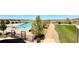 Community pool and landscaped walkway offering a serene outdoor recreation space at 6450 S Riverwood Ct, Aurora, CO 80016