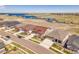 Lovely street view of homes near a lake featuring manicured lawns and beautiful landscaping at 6450 S Riverwood Ct, Aurora, CO 80016