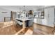 Spacious kitchen boasts a large island, modern appliances, and stylish pendant lighting at 810 N Perry Park Rd, Sedalia, CO 80135