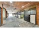 Interior view of horse stables featuring multiple stalls with black metal bars at 810 N Perry Park Rd, Sedalia, CO 80135