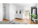Bright bedroom with hardwood floors, white walls, and walk-in closet at 2525 S Meade St, Denver, CO 80219