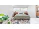 Modern bedroom with a platform bed, stylish rug, and ensuite bathroom at 2525 S Meade St, Denver, CO 80219