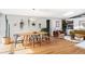 Inviting dining room features a light wood table, pendant lighting and hardwood flooring at 2525 S Meade St, Denver, CO 80219
