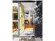 Inviting entryway featuring hardwood floors, a contemporary light fixture, and an open doorway at 2525 S Meade St, Denver, CO 80219