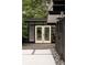 Charming exterior view of home with modern design elements, including a stylish backyard workspace with glass doors at 2525 S Meade St, Denver, CO 80219