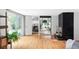 Living room with hardwood floors, sliding glass doors, and a fireplace at 2525 S Meade St, Denver, CO 80219