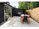 Outdoor patio with a dining area, grill, and modern design, perfect for entertaining and relaxation at 2525 S Meade St, Denver, CO 80219