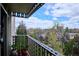 Balcony with city and tree-filled neighborhood views at 1223 Race St # 605, Denver, CO 80206