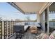 Relaxing balcony with comfortable seating and city views at 1223 Race St # 605, Denver, CO 80206