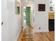 Entry hallway with hardwood floors leading to the interior of the home at 1223 Race St # 605, Denver, CO 80206