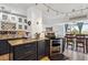 Kitchen features granite countertops, stainless steel appliances, two-tone cabinets and an adjacent dining area at 1223 Race St # 605, Denver, CO 80206