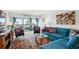 Sunlit living room with a comfortable sectional sofa, colorful accents, and access to an outdoor balcony at 1223 Race St # 605, Denver, CO 80206