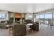 Inviting living room with fireplace, neutral color palette, and access to a large outdoor patio at 1223 Race St # 605, Denver, CO 80206