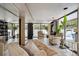 Bright sunroom with comfortable seating, tile floors, floor to ceiling windows, and view of the pool at 1223 Race St # 605, Denver, CO 80206