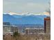 Scenic view of snow-capped mountains, visible beyond the city skyline, presenting a breathtaking landscape at 1223 Race St # 605, Denver, CO 80206