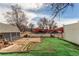 Spacious backyard featuring a brick patio and artificial turf at 1925 S Irving St, Denver, CO 80219