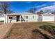 Charming single-story home with a detached garage and an expansive front yard in a suburban setting at 1925 S Irving St, Denver, CO 80219