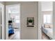Hallway connecting to bedrooms, showing a plant in the cutout shelf in the center at 1925 S Irving St, Denver, CO 80219