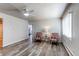Bright living room featuring wood floors, modern ceiling fan and lots of natural light at 1925 S Irving St, Denver, CO 80219