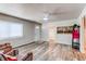 Bright living room showcasing wood flooring, a ceiling fan and plenty of natural light at 1925 S Irving St, Denver, CO 80219