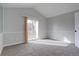 Bright bedroom with balcony access and carpeting at 155 S Sable Blvd # S26, Aurora, CO 80012