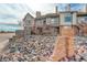 Front view of townhome with brick accents and landscaping at 155 S Sable Blvd # S26, Aurora, CO 80012