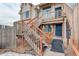 Exterior view of the townhome with stairs and ramp access at 155 S Sable Blvd # S26, Aurora, CO 80012