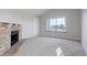 Living room featuring a stone fireplace and window seat at 155 S Sable Blvd # S26, Aurora, CO 80012