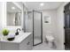 Updated bathroom with gray vanity, shower, and modern fixtures at 3545 W Custer Pl, Denver, CO 80219