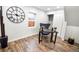 Home office with wood floors, a desk, chair, and large clock at 3545 W Custer Pl, Denver, CO 80219