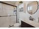 Clean bathroom with walk-in shower and updated vanity at 6727 E 123Rd Dr, Thornton, CO 80602