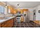 Spacious kitchen with stainless steel appliances and tile flooring at 6727 E 123Rd Dr, Thornton, CO 80602