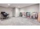 Spacious basement area with plush carpeting, ideal for a recreation room, home office or studio at 21261 E 60Th Ave, Aurora, CO 80019
