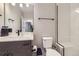 Neutral bathroom with a shower and tub combination, accented with white subway tile and matte black hardware at 21261 E 60Th Ave, Aurora, CO 80019