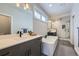 Modern bathroom with a soaking tub, walk-in shower, and dual vanity sinks, offering a spa-like experience at 21261 E 60Th Ave, Aurora, CO 80019