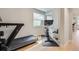 Bright exercise room with modern treadmill and exercise bike, perfect for a home gym at 21261 E 60Th Ave, Aurora, CO 80019