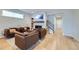 Comfortable living room featuring a fireplace and seamless flow into other living spaces at 21261 E 60Th Ave, Aurora, CO 80019